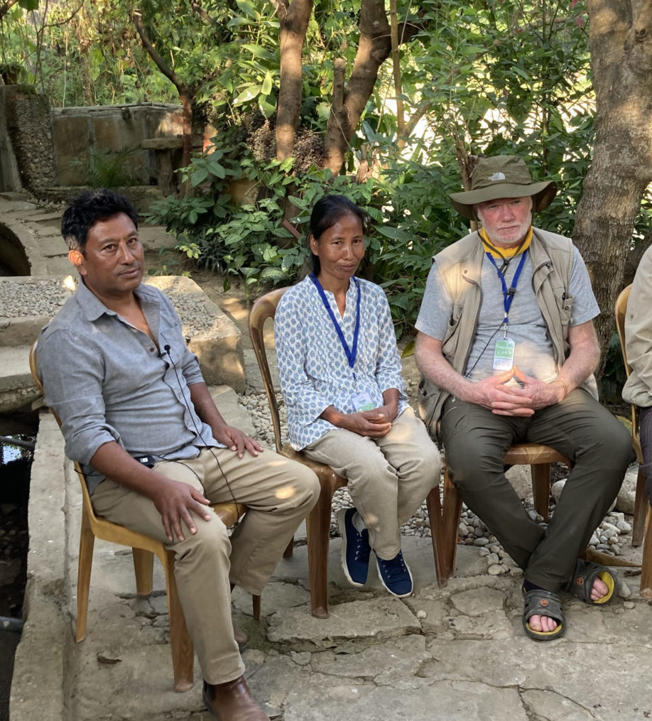 Samir (l), Hommaya Gurung, a trainer for HPC, and Chris Evans discussing the ginger project.