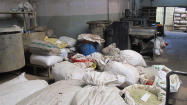 waste bags piled on top of each other in a heap