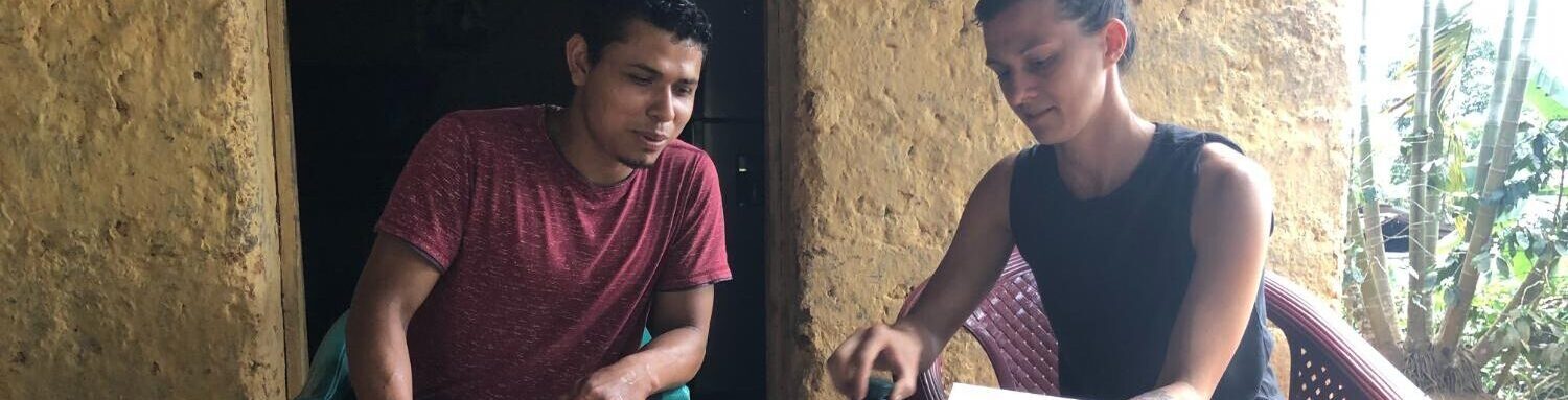 Farmer Nolvin and Stephanie Kane sharing photos of the Gaia production process by Chase Millhollen